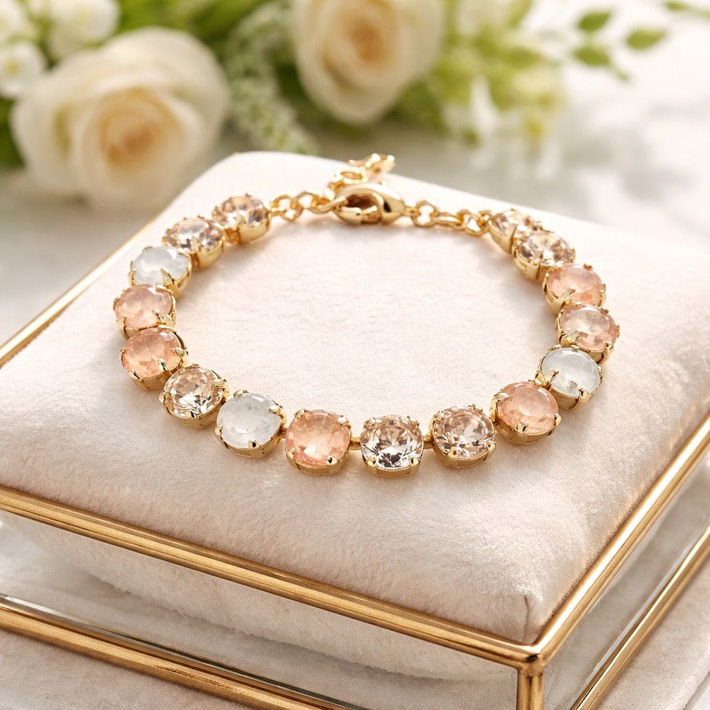 Statement armband peach gold met Swarovski kristallen in goud - elegante schakelarmband met perzikkleurige en heldere ronde stenen
